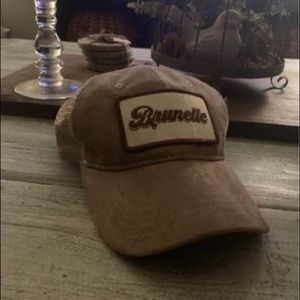 Taupe faux suede “Brunette” snap back hat.